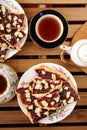 Berry jam cookies in white plate, two cup of tea, white teapot o Royalty Free Stock Photo