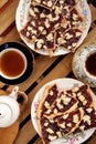 Berry jam cookies in white plate, two cup of tea, white teapot o Royalty Free Stock Photo