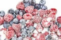 A Berry mix in sugar from frozen raspberries and blueberries. A Frozen Berries with Sugar. A sweet background with frozen