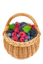 Berry mix in wicker basket isolated on white Royalty Free Stock Photo