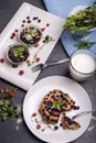 Berry muffin with blueberries and strawberries on a white plate and a wooden table served with milk and and fresh Royalty Free Stock Photo