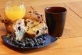 berry muffin with coffee and orange juice Royalty Free Stock Photo