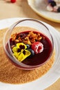 Berry Panna Cotta with Currant-Cointreau jelly in glass bowl