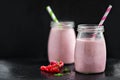 Berry pink smoothies with currant and cranberry, selective focus