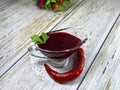 Berry sauce for meat in a gravy boat.