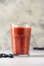 Berry smoothie, fresh banana, blueberry, raspberry, strawberry smoothie in a glass. Royalty Free Stock Photo