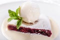 Berry strudel cake served with ice cream, mint leaf and vanilla sauce. Classical austrian dessert on white plate. Sweet Royalty Free Stock Photo