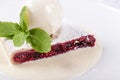 Berry strudel cake served with ice cream, mint leaf and vanilla sauce. Classical austrian dessert on white plate. Sweet Royalty Free Stock Photo