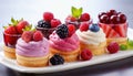 Berry sweet cakes on white background.Delicious berry mini cakes for holiday. Sweet food catering for party