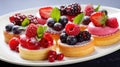 Berry sweet cakes on white background.Delicious berry mini cakes for holiday. Sweet food catering for party