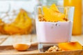 Berry youghurt with granola and fruits in a glass