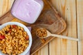 Berry youghurt with granola and fruits in a glass