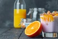 Berry youghurt with granola and fruits in a glass