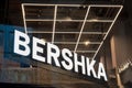 Bershka logo signboard in shop on display for customers