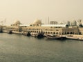 Berth for fishing boats. A fishing pier in the seaport near the fish market building. Royalty Free Stock Photo