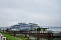 Berth on the river cruise ships embankment, bridge automobile, fog over Royalty Free Stock Photo