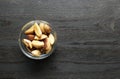 Bertholletia brazil nuts in bowl on a wood
