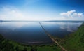 Aerial drone view of lake landscape with road