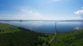 Aerial drone view of lake landscape with road