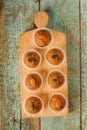 Besan laddu with pumpkin seeds and almond in paper cups