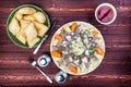 Beshbarmak dish with baursak - traditional Kazakh Asia food and national bread. Noodles with lamb and onion close-up on Royalty Free Stock Photo