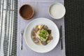 Beshbarmak - National Kazakh dish, prepared with meat and pasta. Beshbarmak dish close-up on a plate on the table. Large pieces of Royalty Free Stock Photo