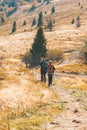 Beskids mountains, Poland - october 12, 2019 Two old people actively spend weekends in the autumn mountains go to Hiking