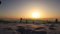 Beskydy / Czech Republic, Europe - 8. February 2020: Adolescent make a star in snow at sunrise. Enjoying childhood. Modern outdoor