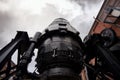 Bessemer converter steel and iron foundry equipment Sheffield bulk metal production. stormy cloud and large black gears Royalty Free Stock Photo