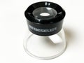 Bessler Magnifying Loop on a White Backdrop. Royalty Free Stock Photo