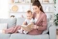 Best Baby Books. Loving Mom Reading To Her Toddler Son At Home Royalty Free Stock Photo