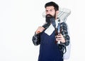 The best bbq in the city. Grill cook holding portable bbq tools. Bearded man with bbq grid and cooking tools in hands