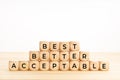 Best, better, acceptable words on wooden blocks on table. Rating concept