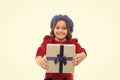 Best birthday and christmas gifts. Kid little girl in elegant dress curly hairstyle hold gift box. Child excited about