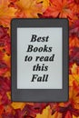 Suggested Fall reading on an e-reader on fall leaves for your au