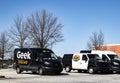 Best Buy retail store exterior geek squad vans parked