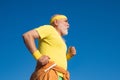 Best cardio workout. The old and young sportsmen running on the road. Portrait of healthy senior sport man. Summer and