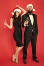 Best champagne for New Year Eve. Couple in love party with santa look. Happy family celebrate new year and Christmas Royalty Free Stock Photo