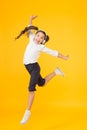 The best dancer. Adorable small dancer moving to music playing in headphones. Little dancer performing ballet leap on Royalty Free Stock Photo