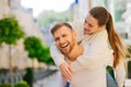 Young woman behind mans back hugging behind his neck Royalty Free Stock Photo