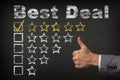 Best deal five 5 star rating. thumbs up service golden rating stars on chalkboard Royalty Free Stock Photo