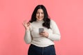 Beautiful Plus Size Model Girl Holding Smartphone And Gesturing Ok Sign Royalty Free Stock Photo