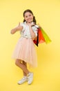Best discounts and promo codes. Girl carries shopping bags. Back to school season great time to teach budgeting basics Royalty Free Stock Photo