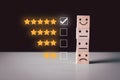 Best excellent smiley face business services rating customer experience.five star on top wood block cube Royalty Free Stock Photo