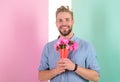 Best flowers for her. Macho holds bouquet as romantic gift. Guy bring romantic pleasant gift waiting for her. Man ready Royalty Free Stock Photo