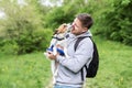 Best friend dog concept. Dog kissing happy man owner on the face. People and pet animals have fun and love together in friendship. Royalty Free Stock Photo