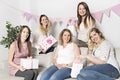 Best Friends on baby shower party celebrating giving kid stuff as present Royalty Free Stock Photo