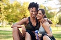 We are best friends. Cropped portrait of two attractive young women sitting close to each other and smiling while in the Royalty Free Stock Photo