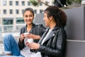 Best friends drinking coffee in city Royalty Free Stock Photo