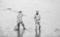 best friends. father and son fishing. Poaching. Camping on the shore of lake. concept of a rural getaway. hobby. wild Royalty Free Stock Photo